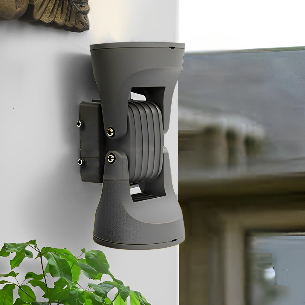 Adjustable outdoor wall light with close-up of its adjustable head and light output.