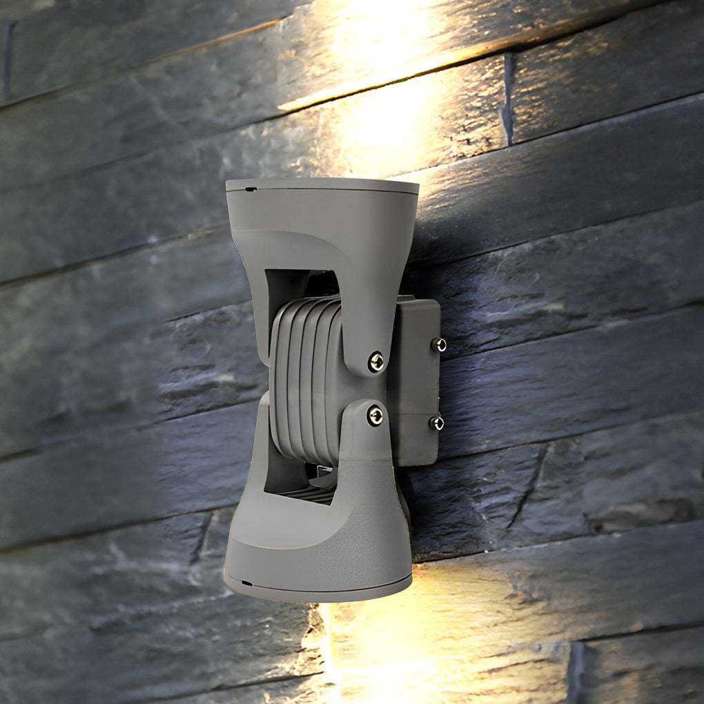 Adjustable outdoor wall light enhancing a modern outdoor seating area with warm light.