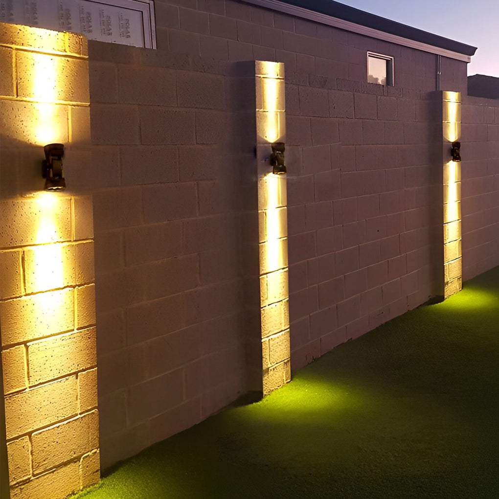 Adjustable outdoor wall light with detailed view of its rotating structure.