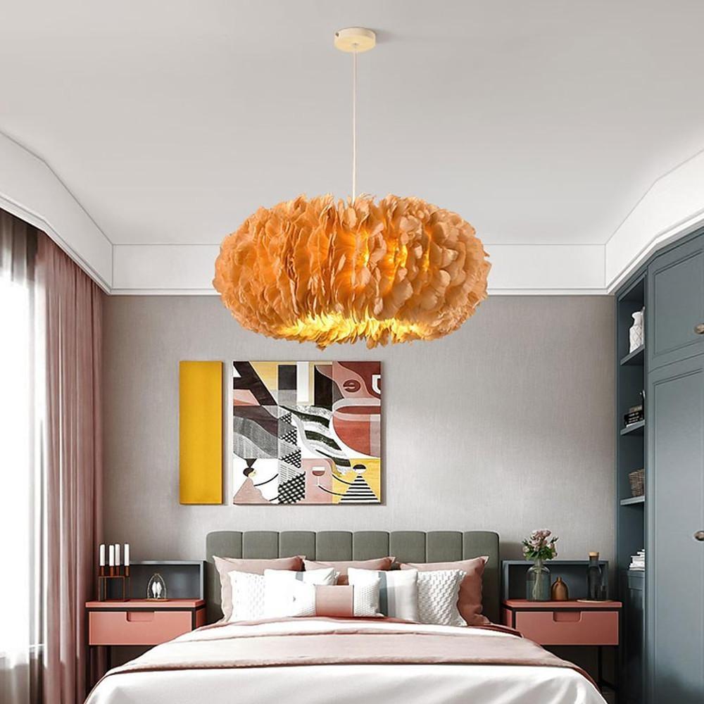 Stylish bedroom showcasing an amber colored fluffy hanging light adding warmth and texture.