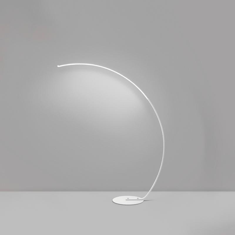Close-up of arcing floor lamp showcasing its sleek curved design and modern finish.