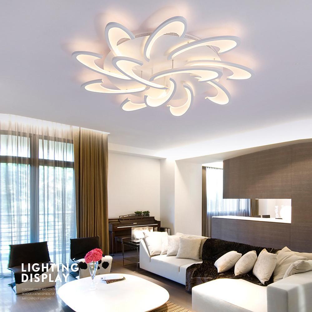 Artistic curved LED ceiling light design illuminating a modern living room.