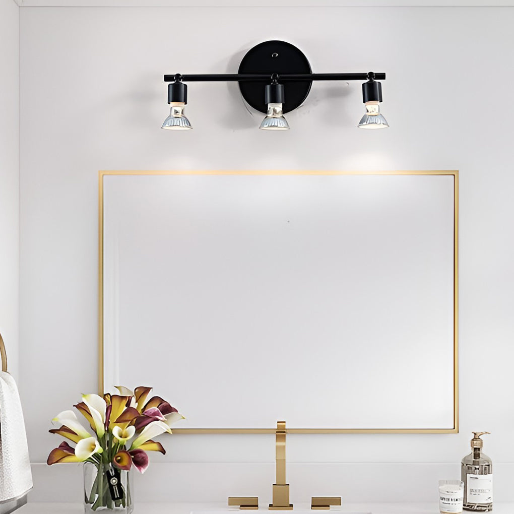 Black adjustable ceiling lights above a bathroom mirror, offering targeted lighting with adjustable spot heads.
