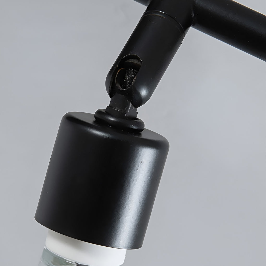 Black adjustable ceiling lights close-up showing adjustable joint mechanism and matte black metal finish.