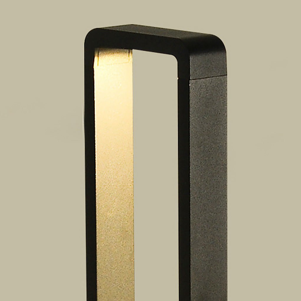 Black bollard lights with a close-up of the light source and housing.