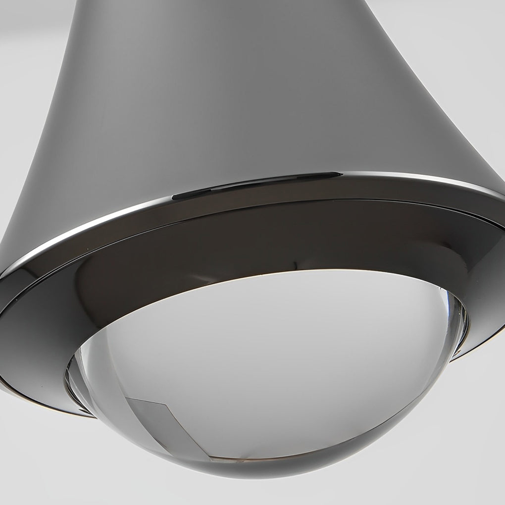 Close-up of black cone pendant lights diffuser and lower metal edge detail.