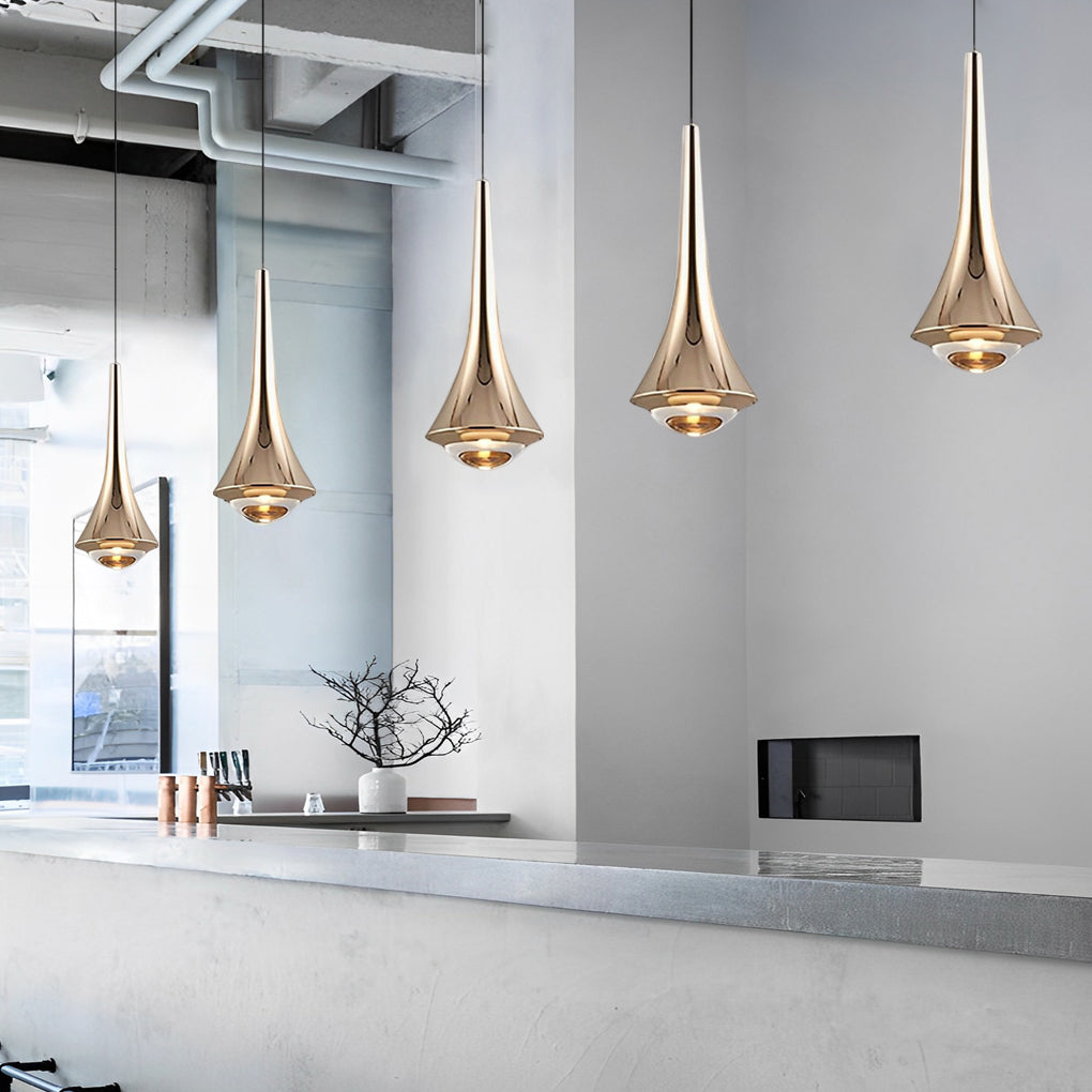 Black cone pendant lights with metallic finish hanging above a sleek dining counter.