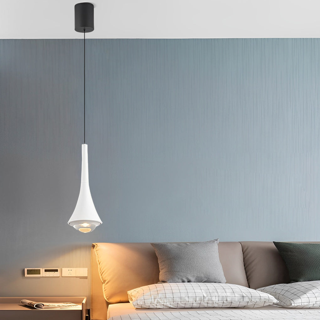 Single black cone pendant lights mounted beside a modern bed for focused lighting.