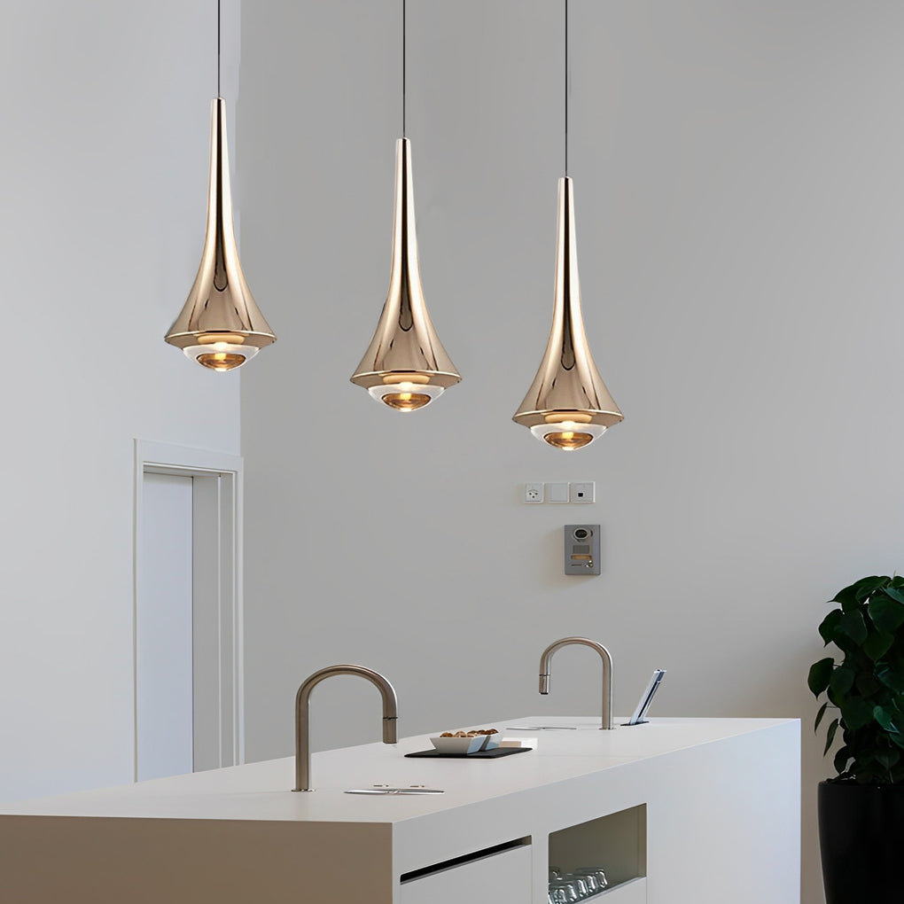 Elegant black cone pendant lights above a white kitchen counter in a minimalist interior.