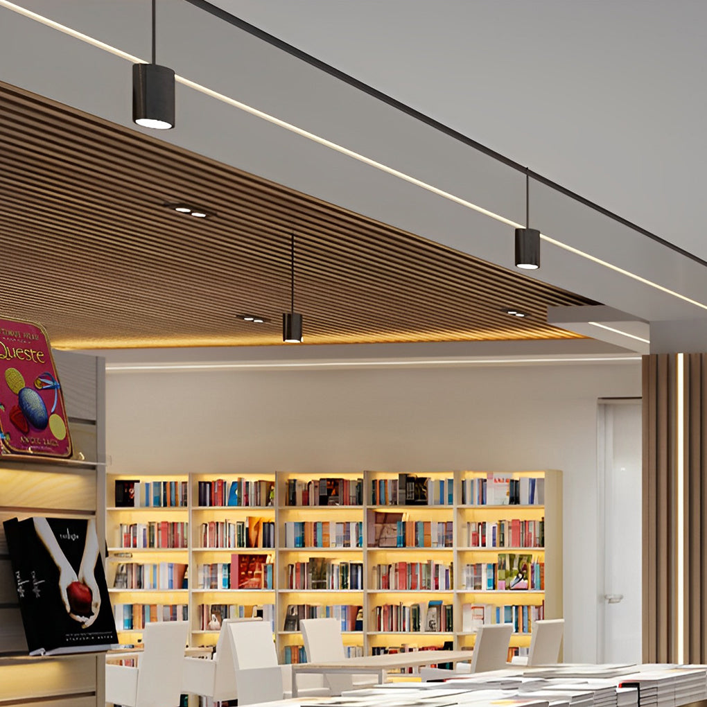 Black drum pendant light with close-up of its sleek design and light output.