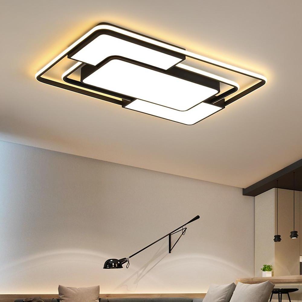 Modern square flush mount ceiling light with black frame and warm backlighting