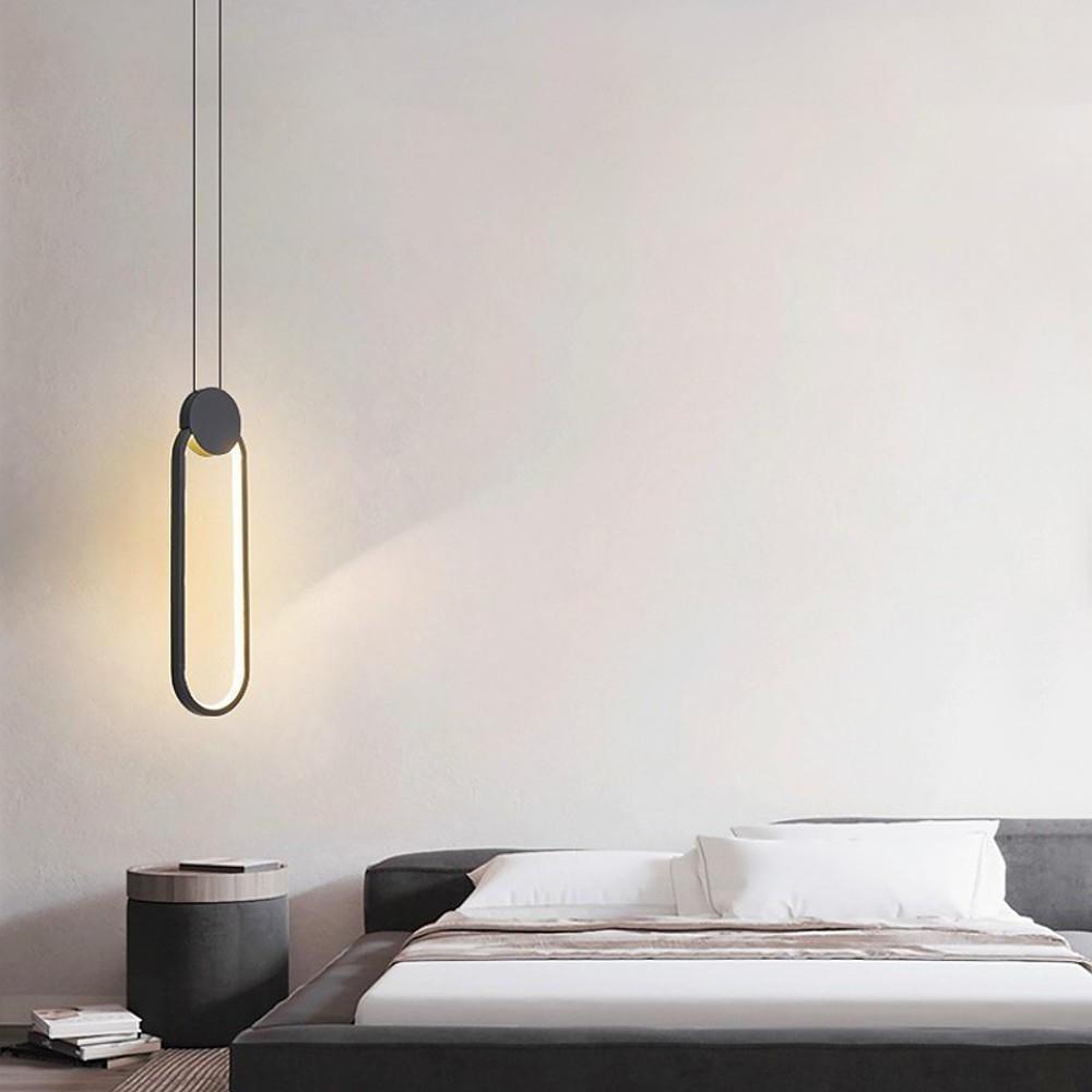 Slim black geometric pendant light providing soft ambient bedroom lighting.