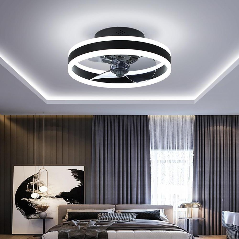 Black and gold ceiling fan with LED ring light in modern interior space.