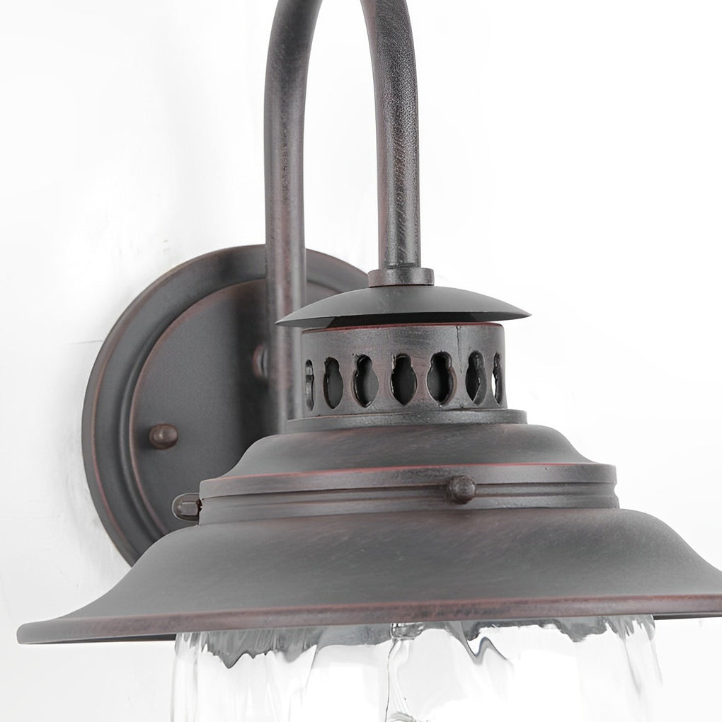 Black gooseneck wall light close-up of metal shade and mounting base, outdoor industrial farmhouse wall fixture design.