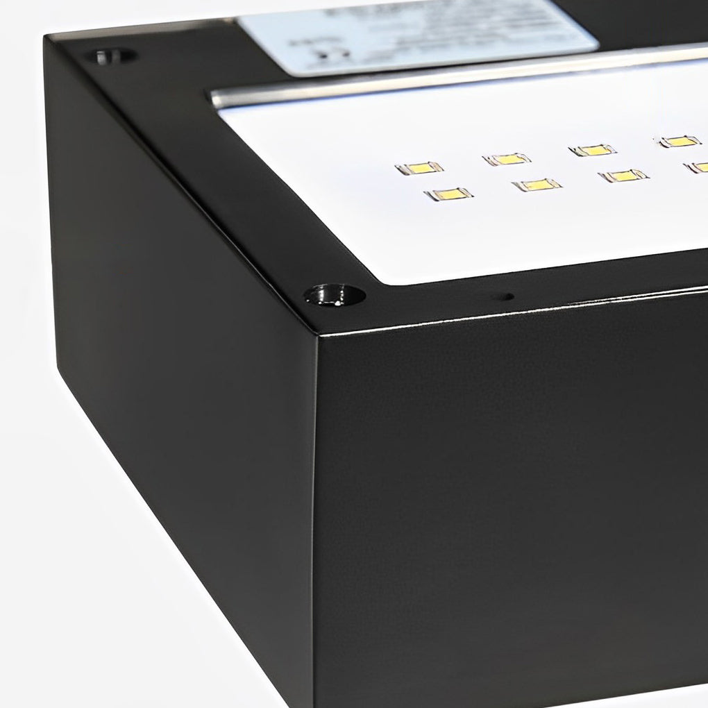 Black motion sensor outdoor wall light with detailed view of its waterproof structure.