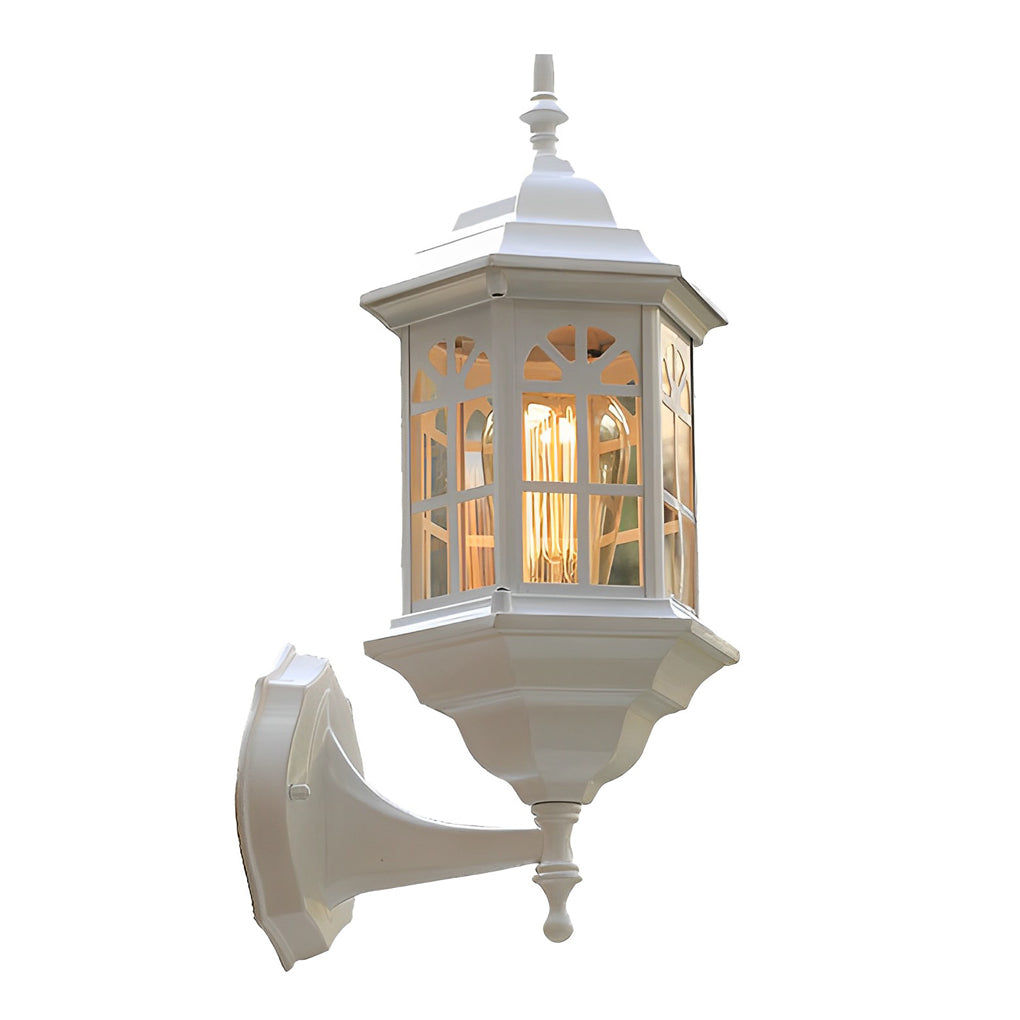 Black outdoor lantern sconce in vintage style, front view of the ornate design.