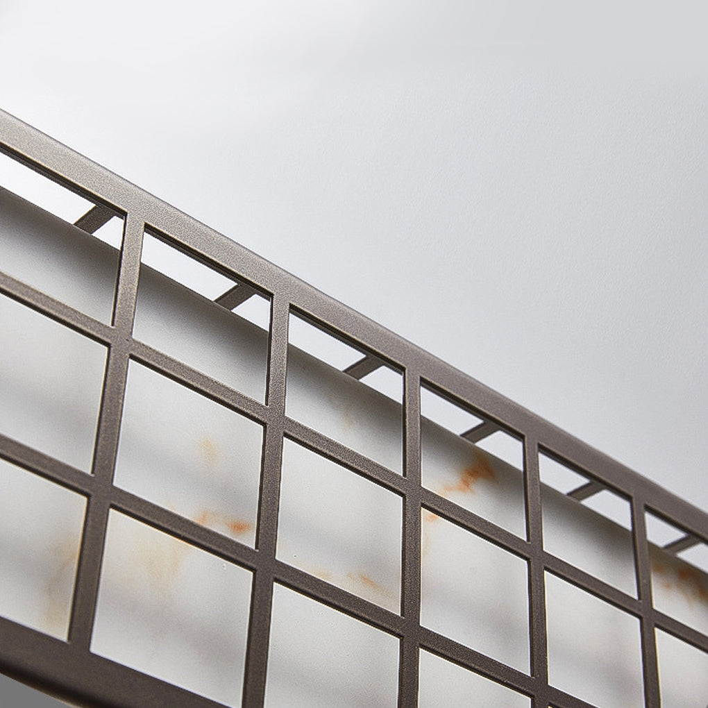 Black outdoor sconce light with grid design mounted on modern metal railing.