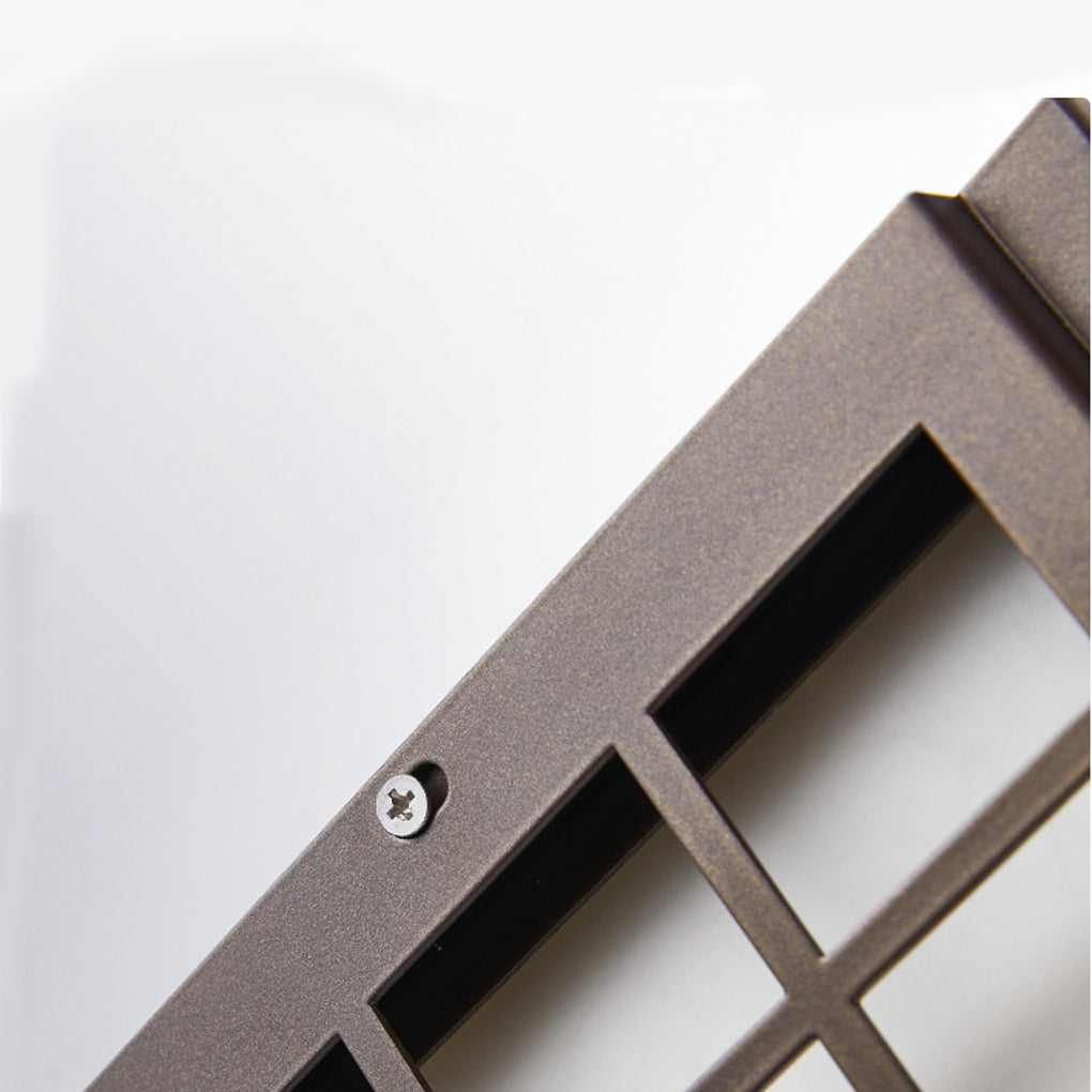 Close-up of black outdoor sconce light showing grid pattern and mounting bracket details.