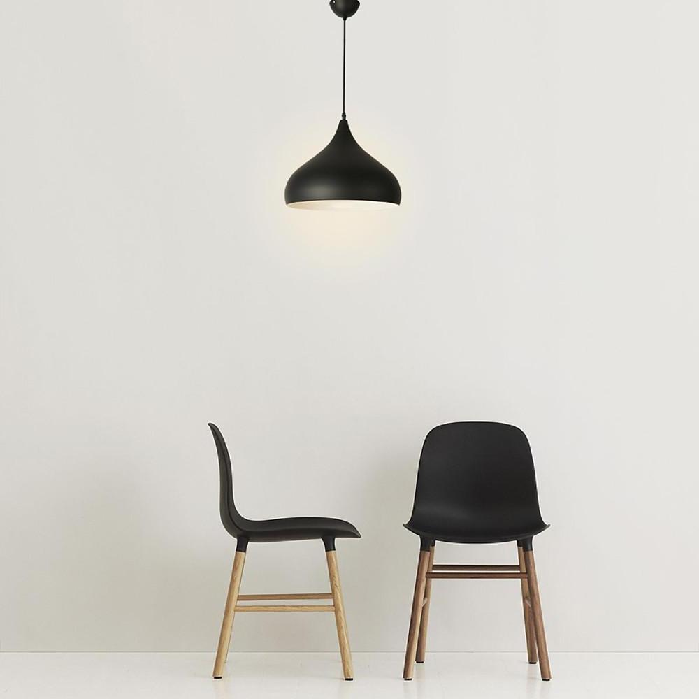Modern black pendant light fixture with a sleek minimalist design for contemporary spaces.