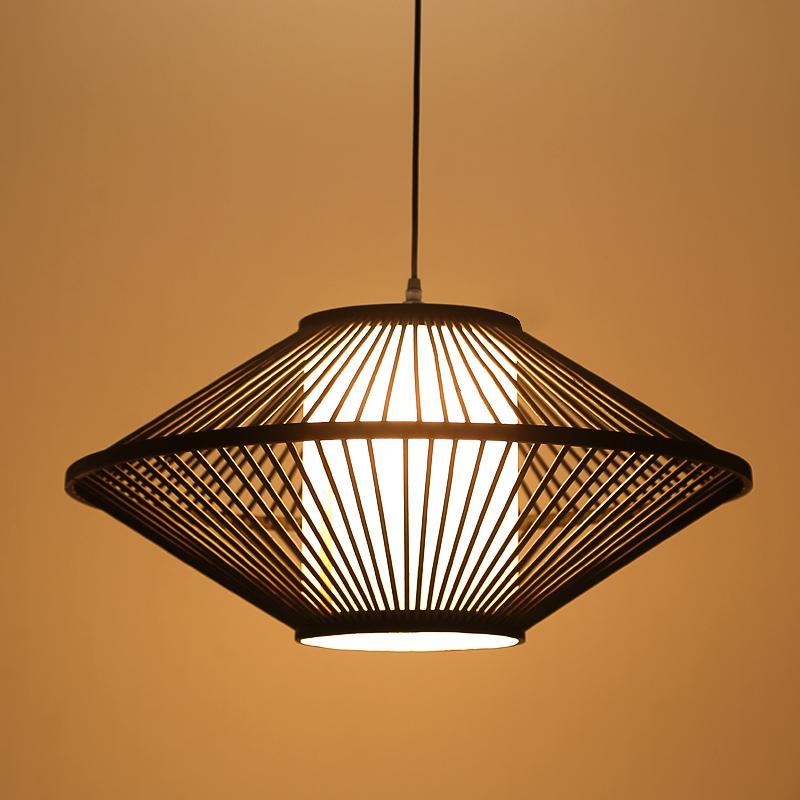 Close-up of black rattan pendant light showcasing its intricate woven design.