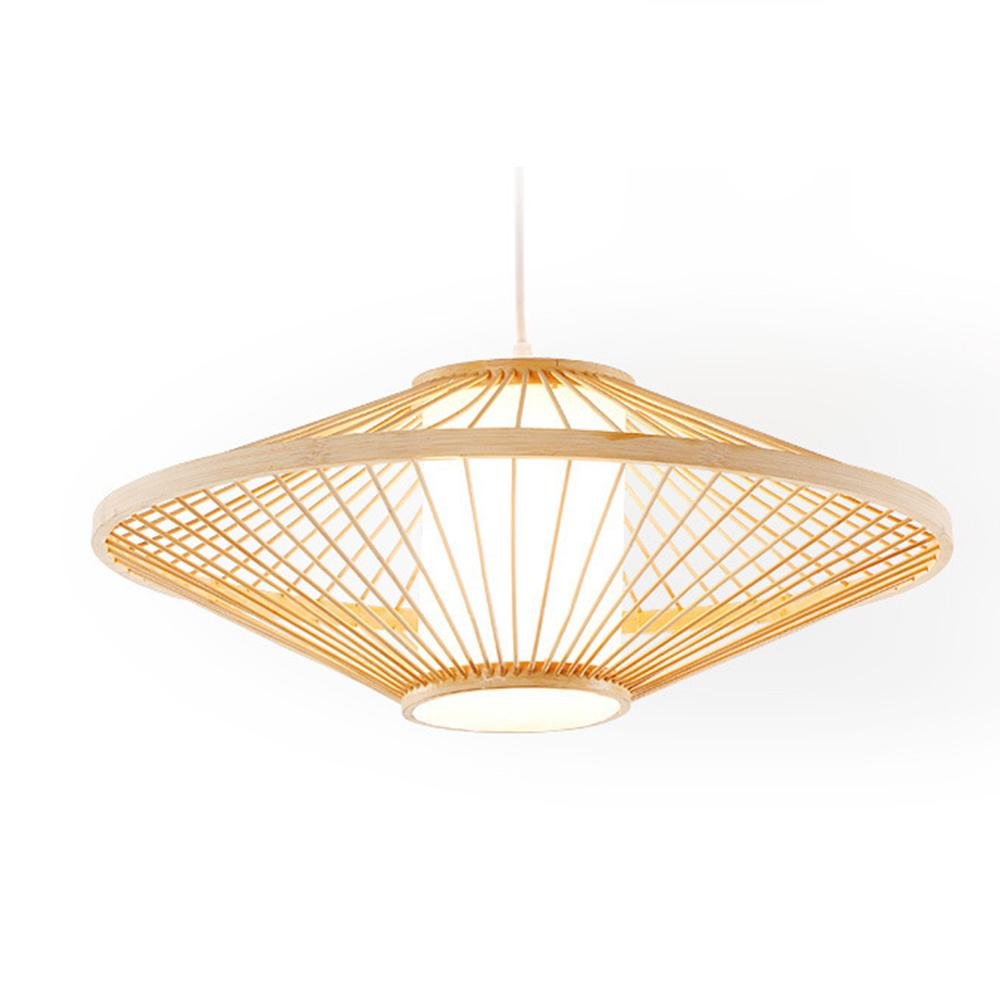 Black rattan pendant light with a geometric design, hanging above a minimalist dining table.