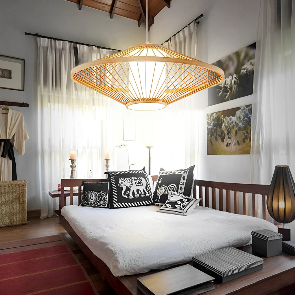 Black rattan pendant light with a woven design, hanging in a stylish living room.