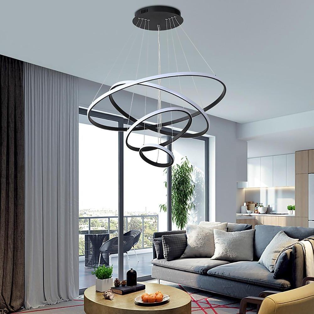 Black ring LED chandelier installed near floor-to-ceiling windows.