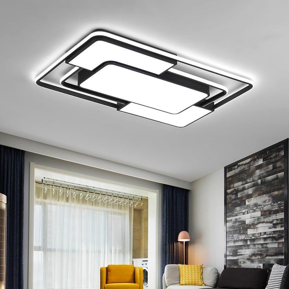 Black square flush mount ceiling light installed in a modern living room