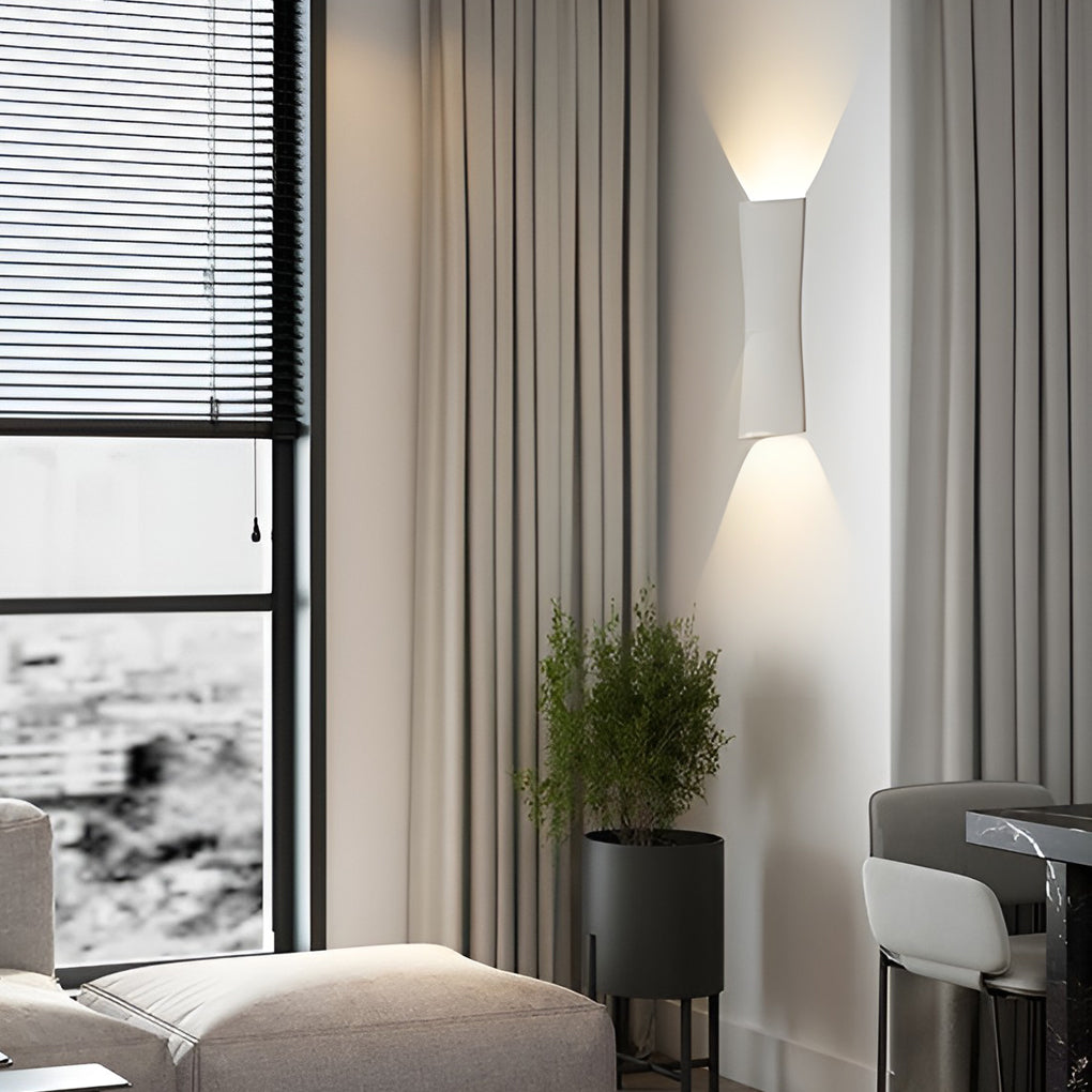 Black up and down exterior wall light highlighting vertical wall lines with warm lighting effect.