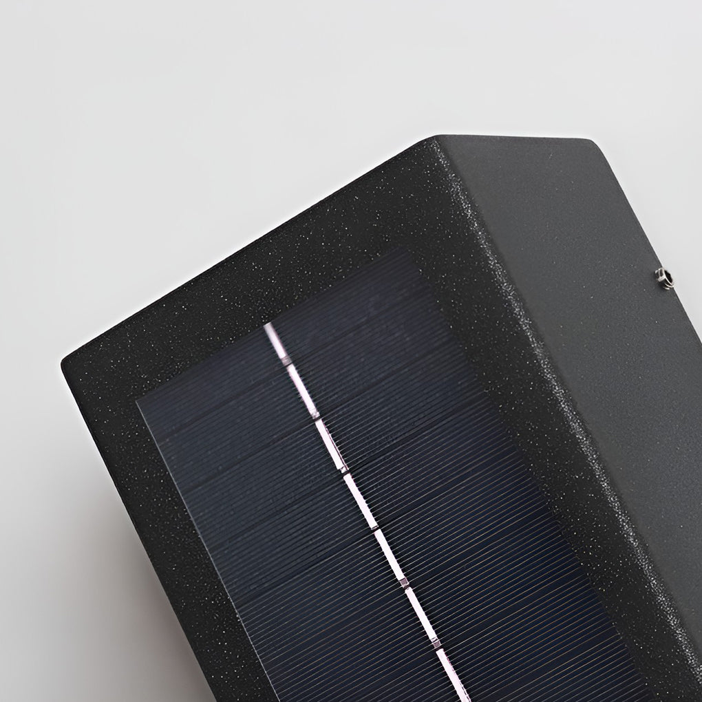 Black up down wall light with integrated solar panel top view