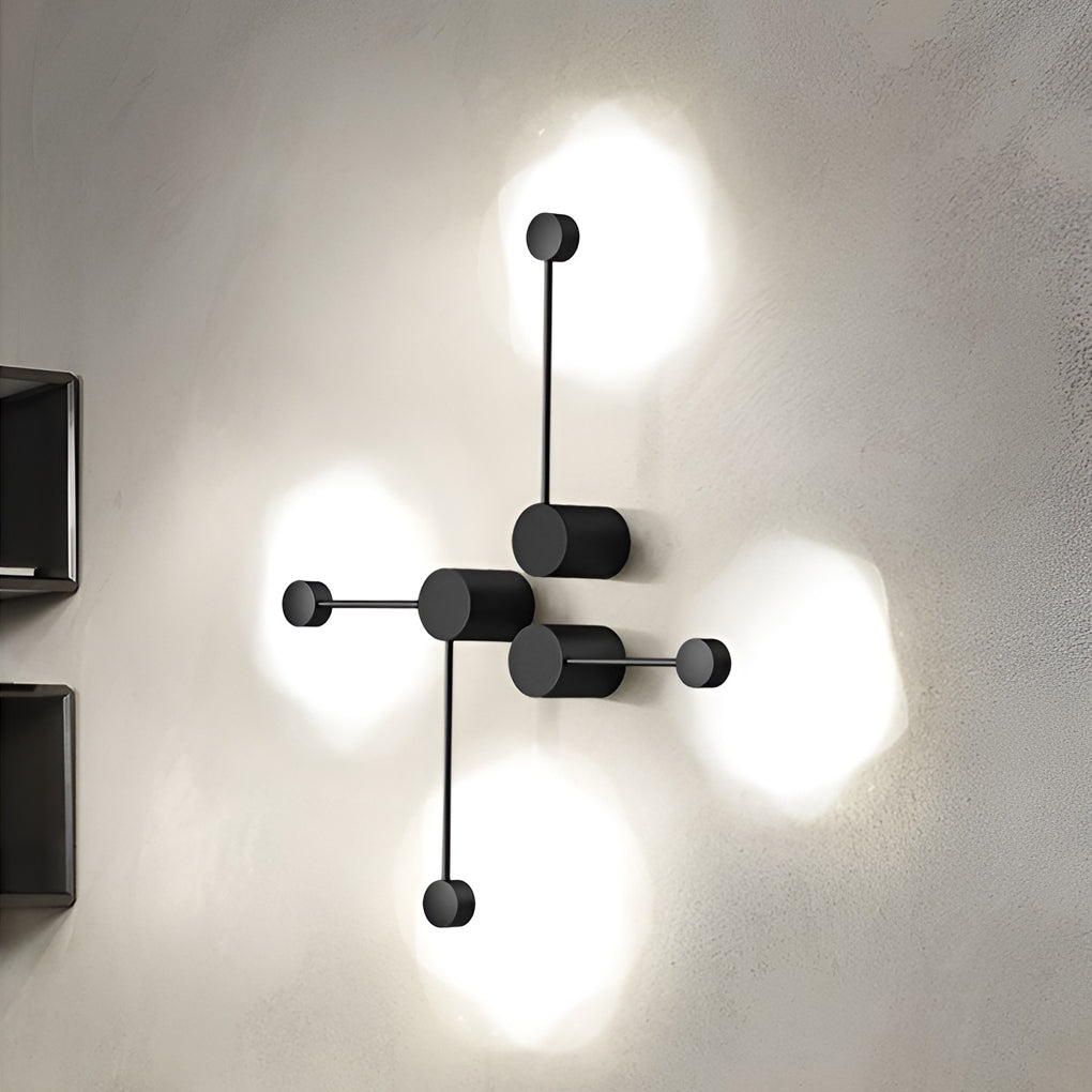 Black wall light illuminating a chic café corner with ambient light.