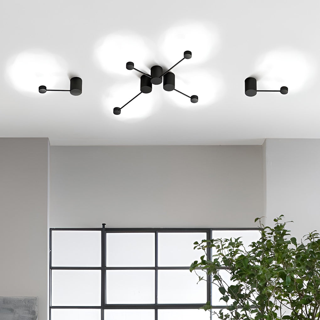 Black wall light providing elegant illumination for a contemporary study.