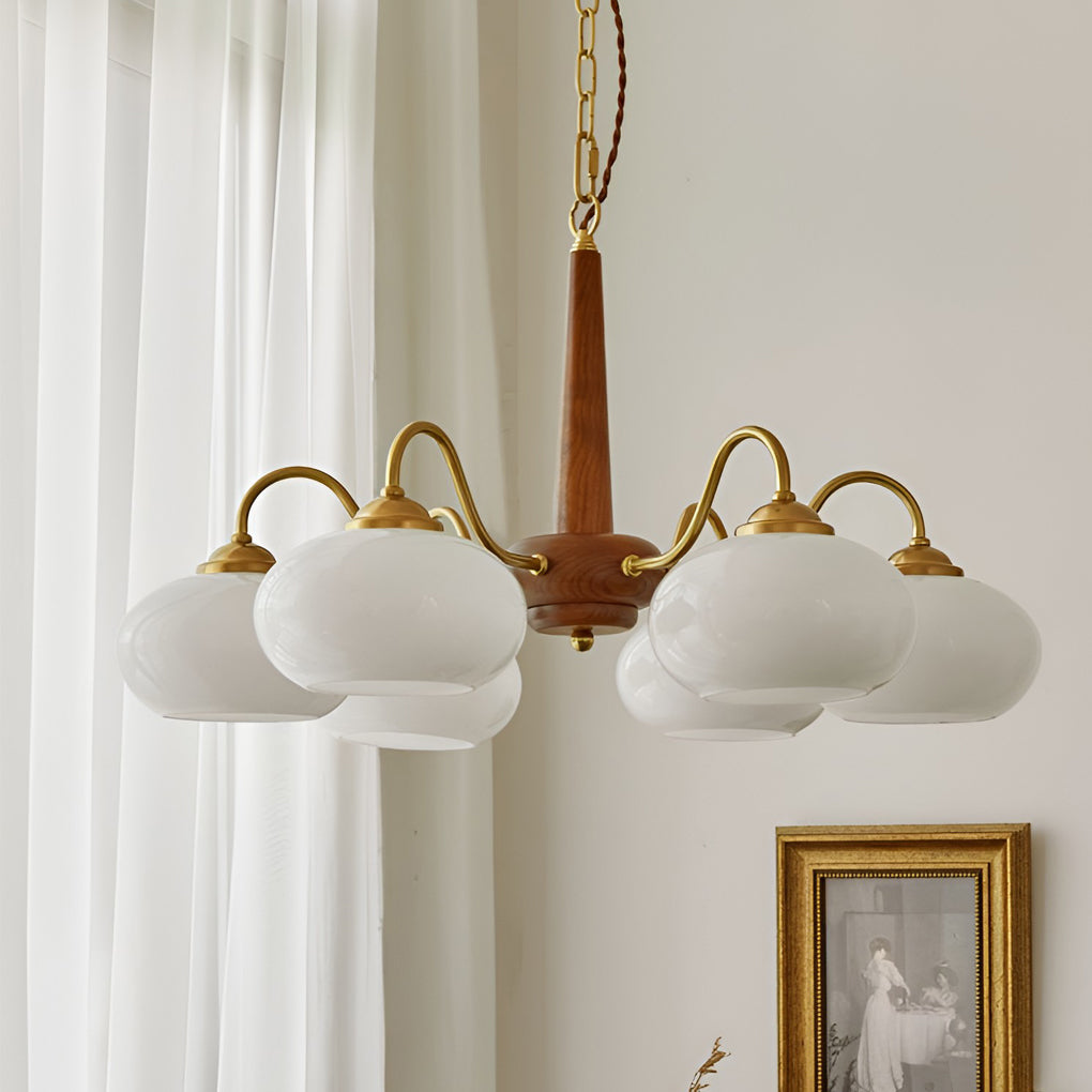 Black walnut brass chandelier providing elegant illumination for a vintage-themed room.