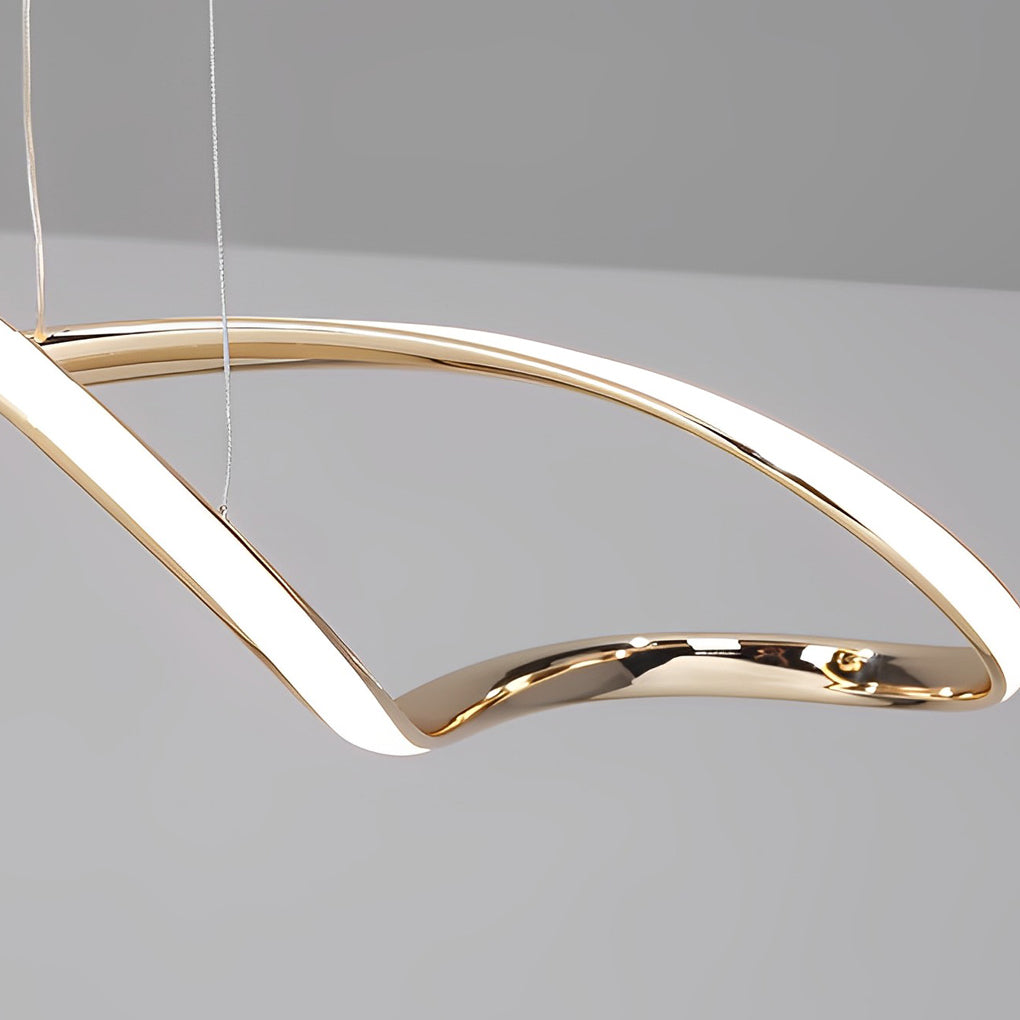 Waveform pendant light with black finish hanging above dining table and chairs.