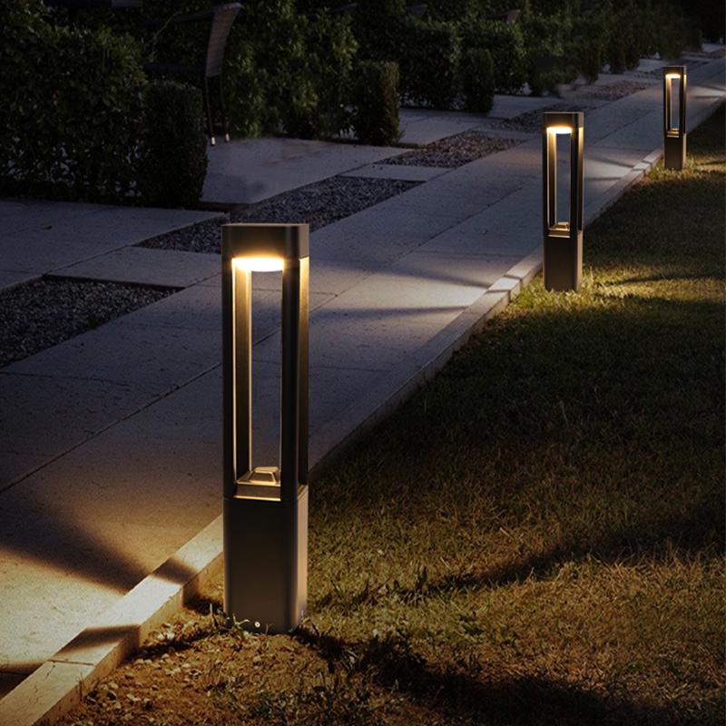 black aluminum LED bollard lights along a straight path