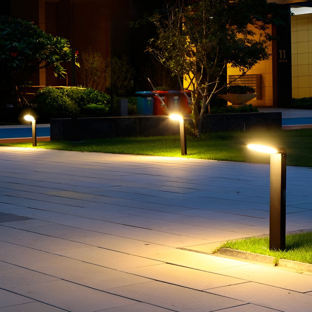 Bollard landscape lights illuminating a cozy outdoor deck with directional glow.