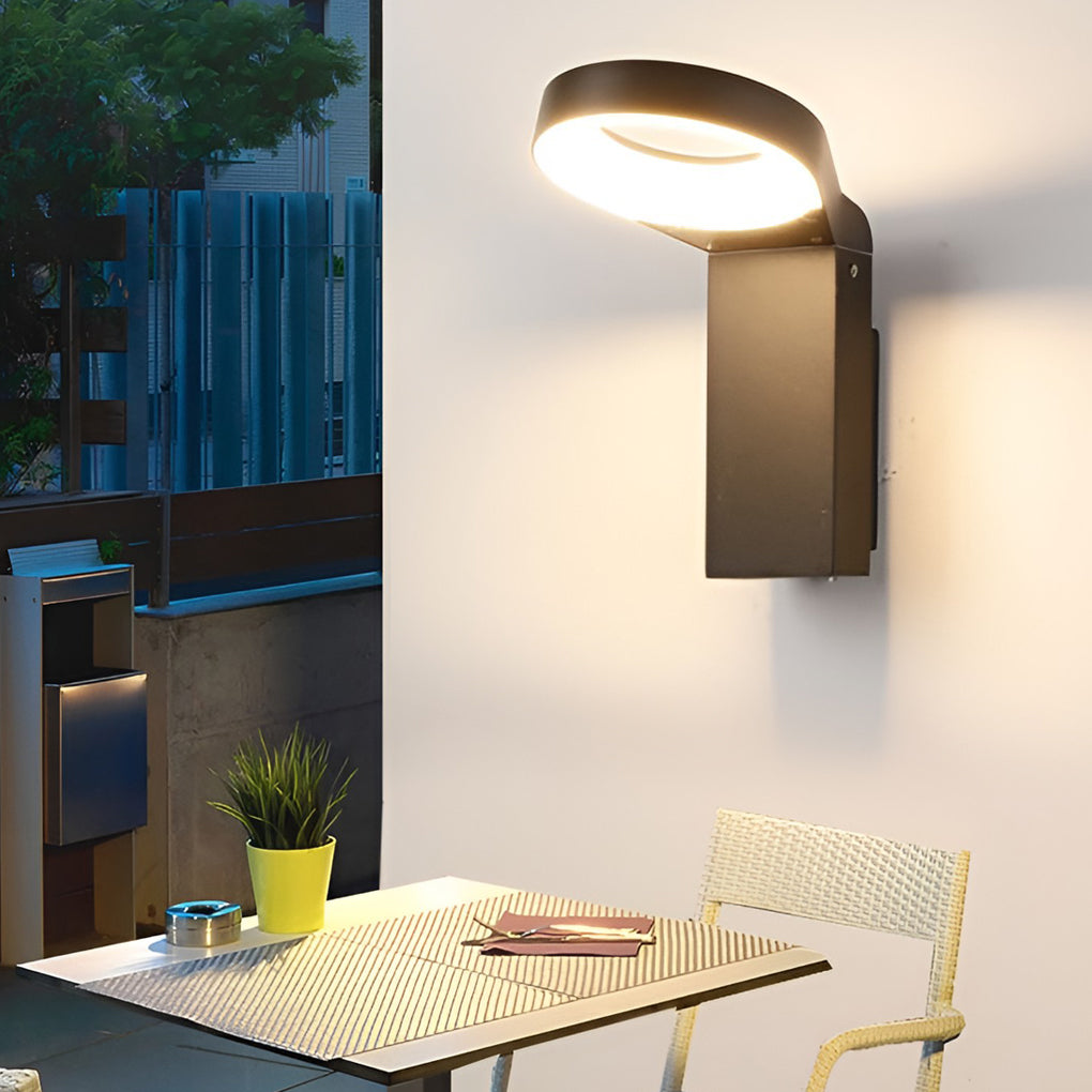 Bollard landscape lights enhancing a modern outdoor seating area with warm light.