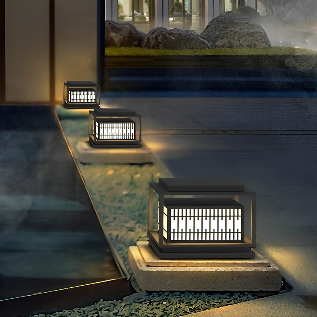 Bollard path lights providing elegant illumination for a contemporary garden.