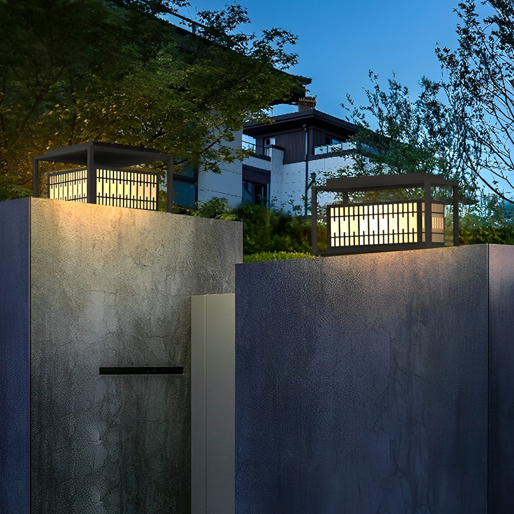 Bollard path lights enhancing a modern outdoor seating area with warm light.