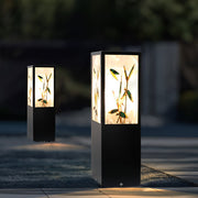 Bollard pathway lights illuminating a modern garden walkway with warm directional glow.