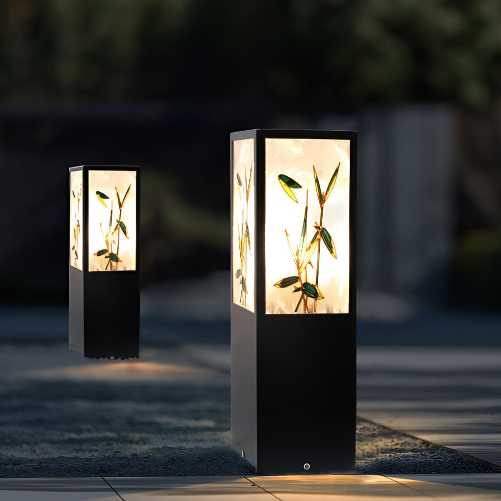 Bollard pathway lights illuminating a modern garden walkway with warm directional glow.