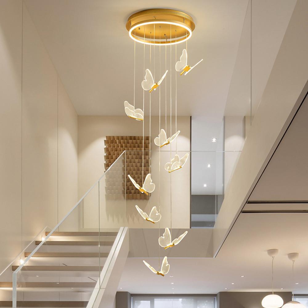 Elegant butterfly chandelier illuminating a cozy living room at night.