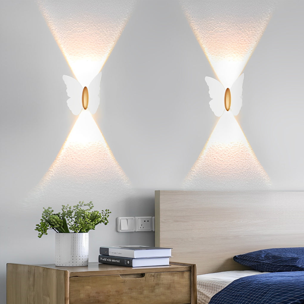 Butterfly wall lamp illuminating a minimalist bedroom with focused glow.