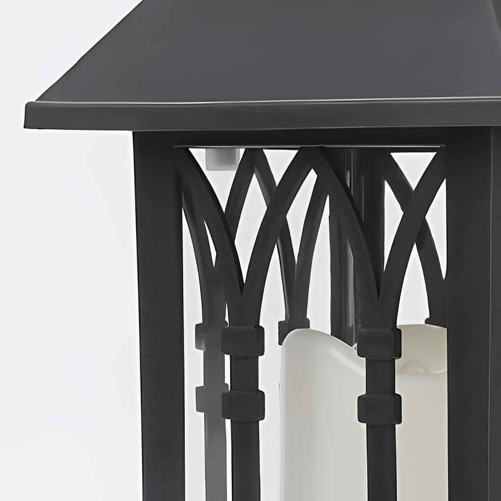 Candlestick lantern with black metal frame on white background.