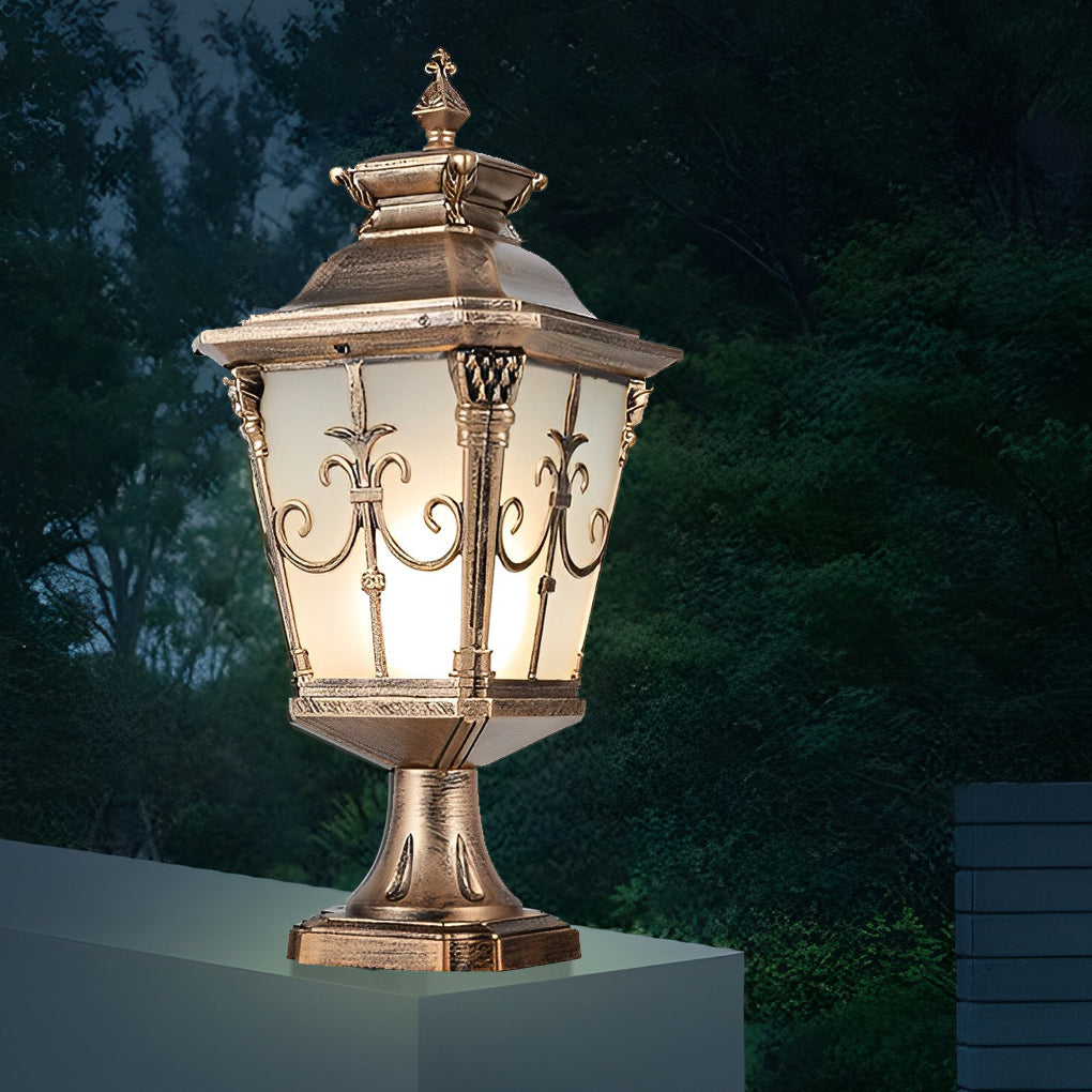 Cast aluminum post light with bronze finish and frosted glass, enhancing the elegance of an outdoor patio.