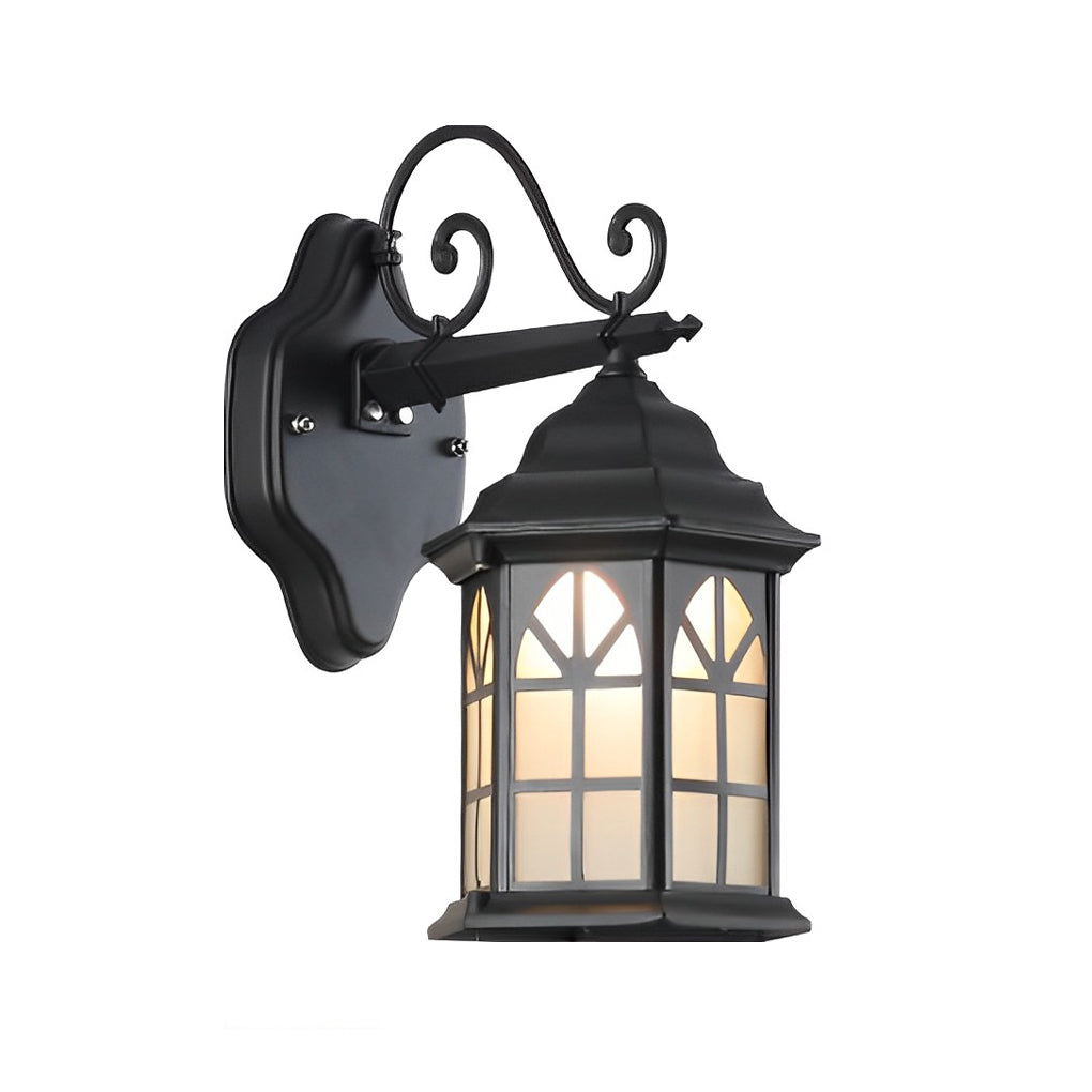 Classic porch light with bronze finish and frosted glass, mounted on a white exterior wall for a welcoming glow.