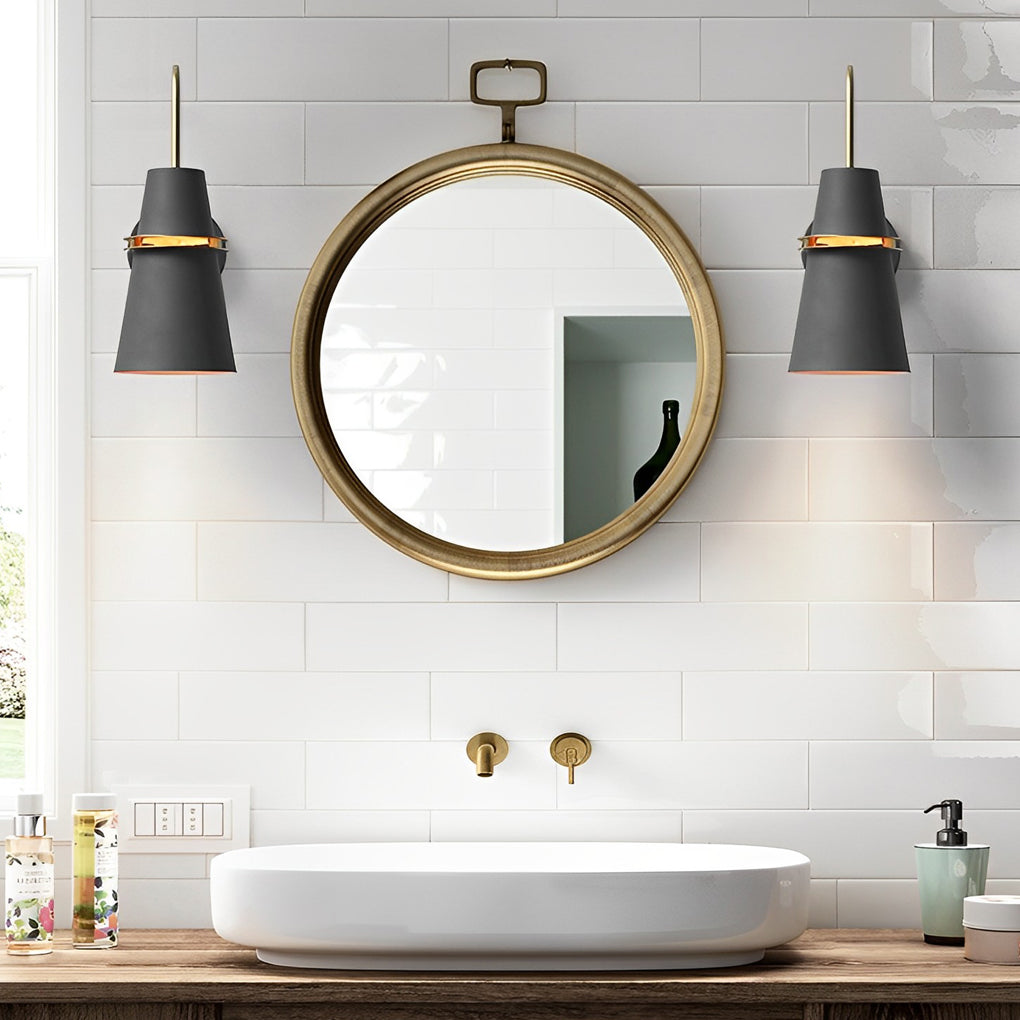 Pair of black cone wall lamps installed beside bathroom mirror above vanity.