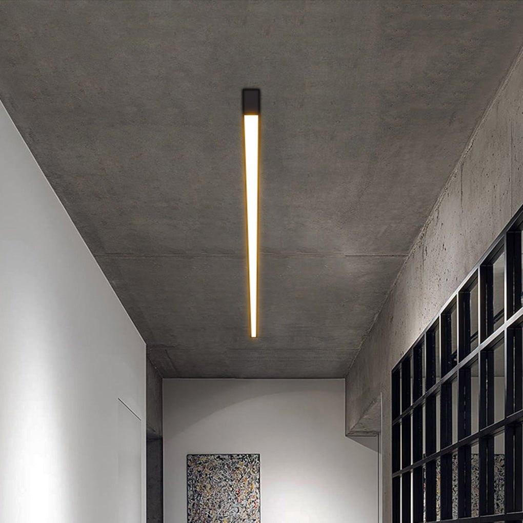 Contemporary linear ceiling light integrated into clean white ceiling design.