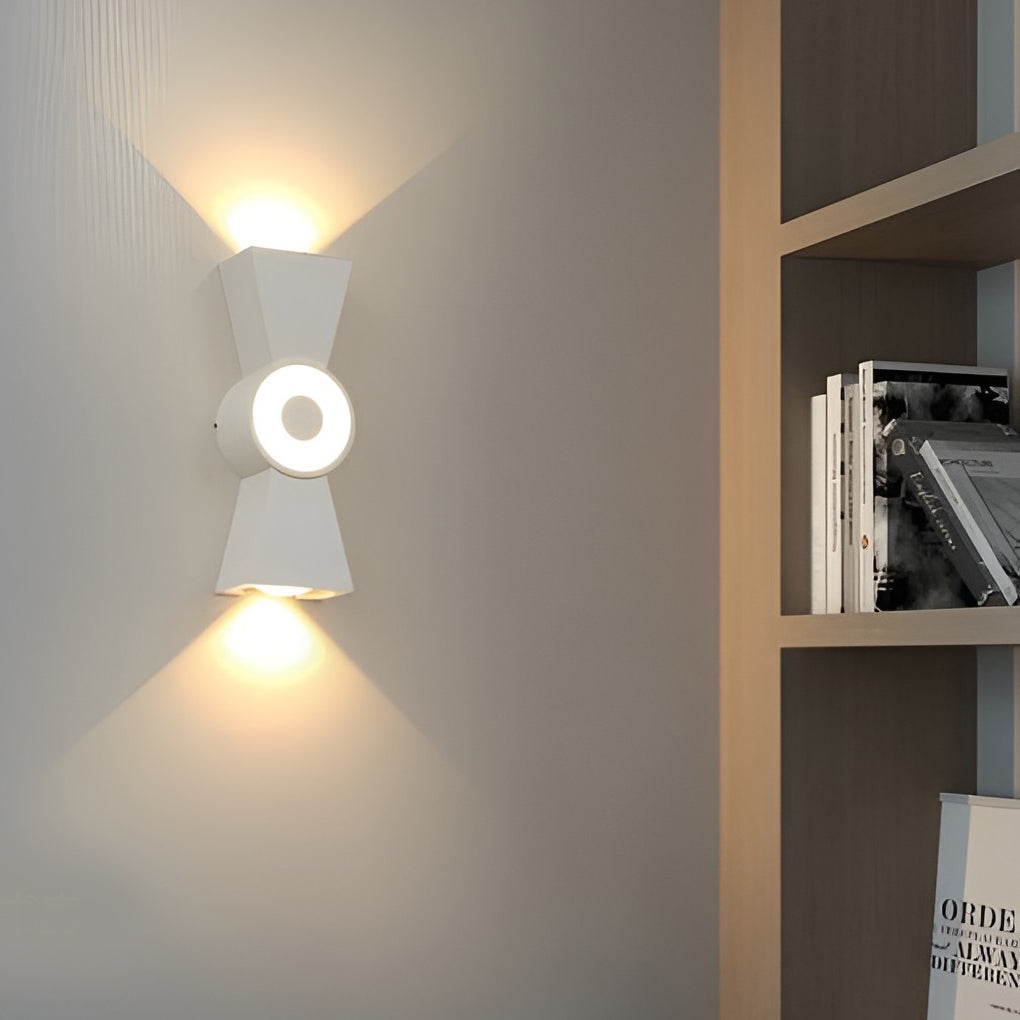 Contemporary up down wall lights providing directional light in a cozy indoor hallway.