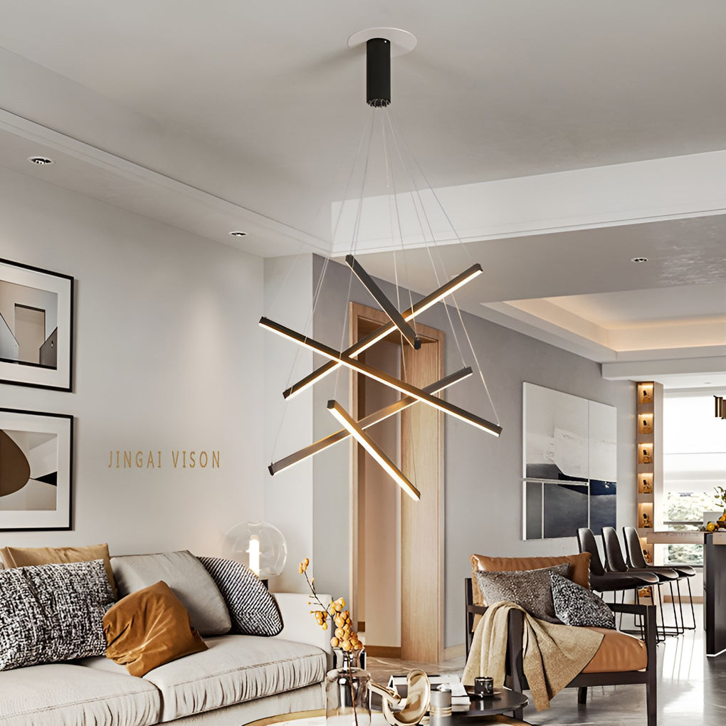 Criss linear chandelier with gold and black accents, elegantly hanging above a modern dining area. 